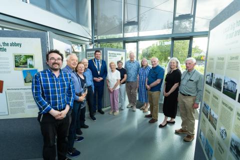 People standing in Deansgrange Library surrounded by exhibition boards